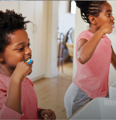 girls brushing their teeth